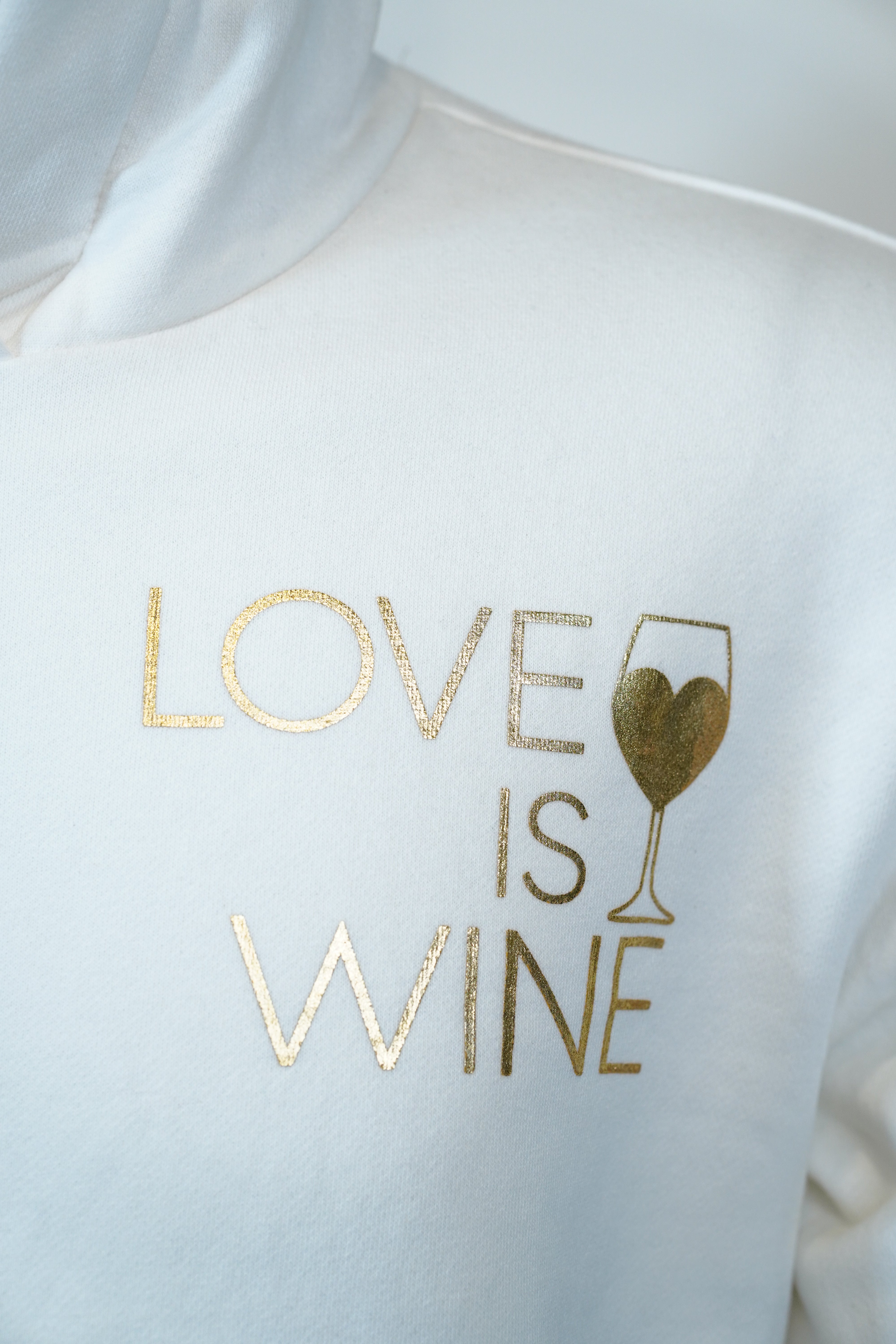 Plain White Hoodie with “Love is Wine” Pocket Print – Minimal & Trendy Style 🕊️